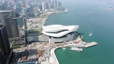 hong kong famous convention and exhibition centre building in victoria harbour, top down aerial view