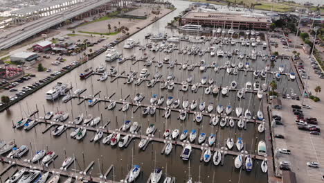 boats at marina near kemah boardwalk during golden hour