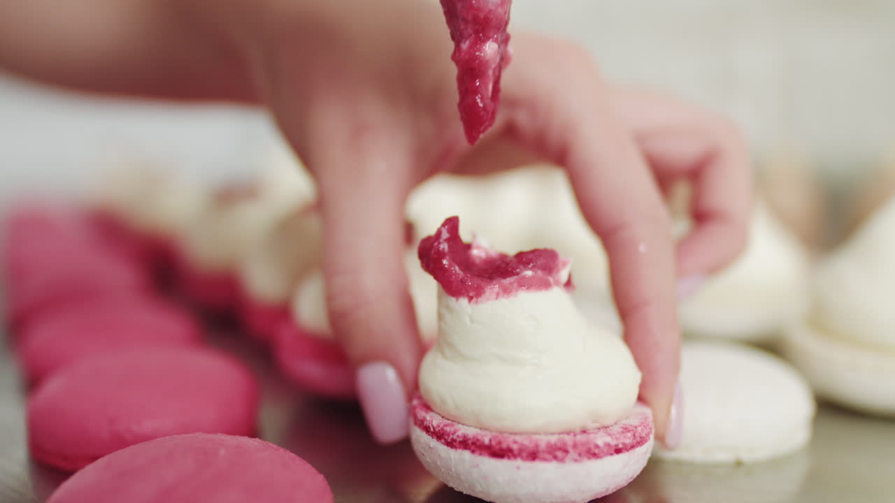 Woman decorating macarons