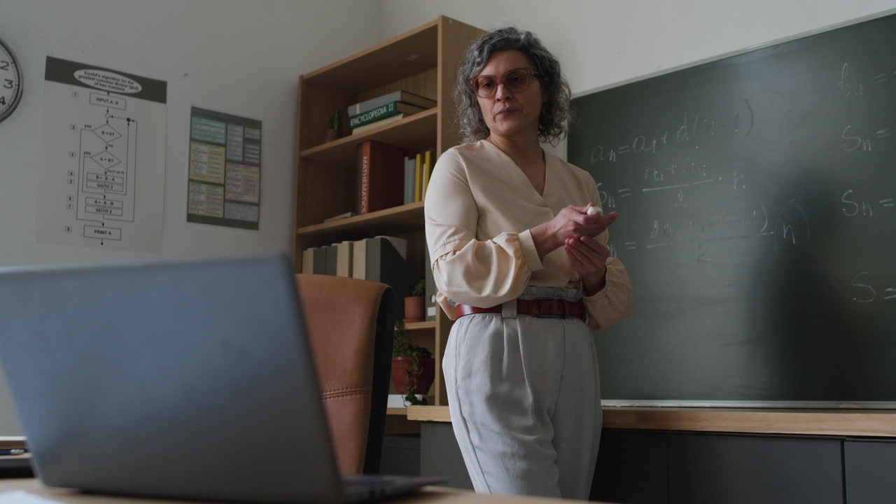 Teacher Giving a Lecture in a Classroom