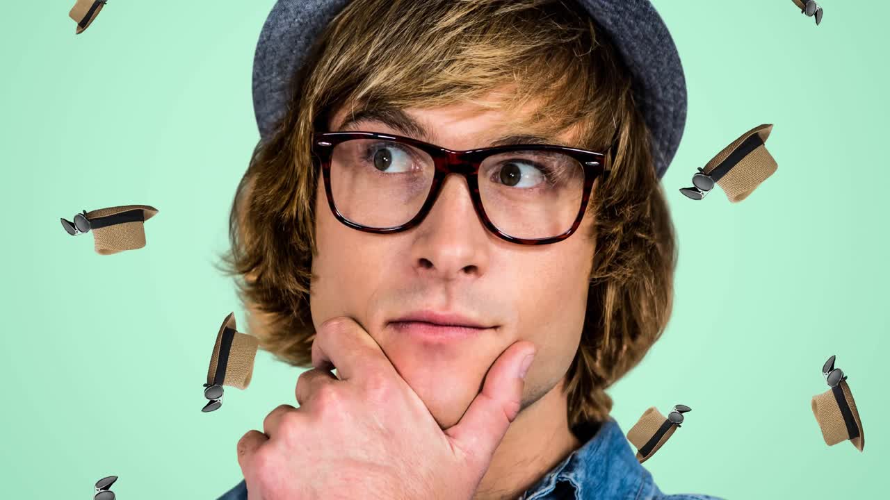 animación de un hombre caucásico con sombrero y gafas sobre sombreros caídos sobre fondo verde