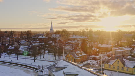 beautiful aerial along a promenade during winter months, filmed in haapsalu, estonia