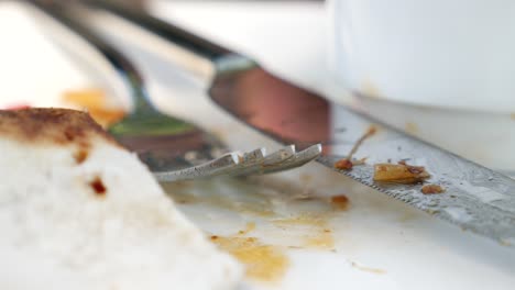 dirty plate with fork and knife