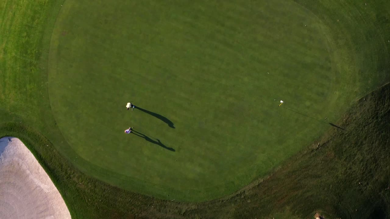 Aerial view of a golf course with golfers