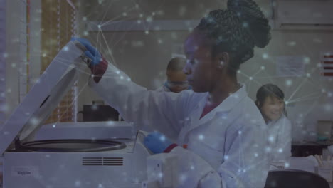 animation of network of connections over african american female scientist taking sample in lab