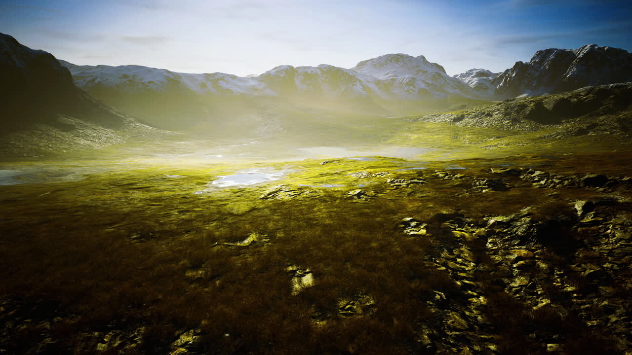 Majestic mountain landscape with lush valley and distant snow capped peaks