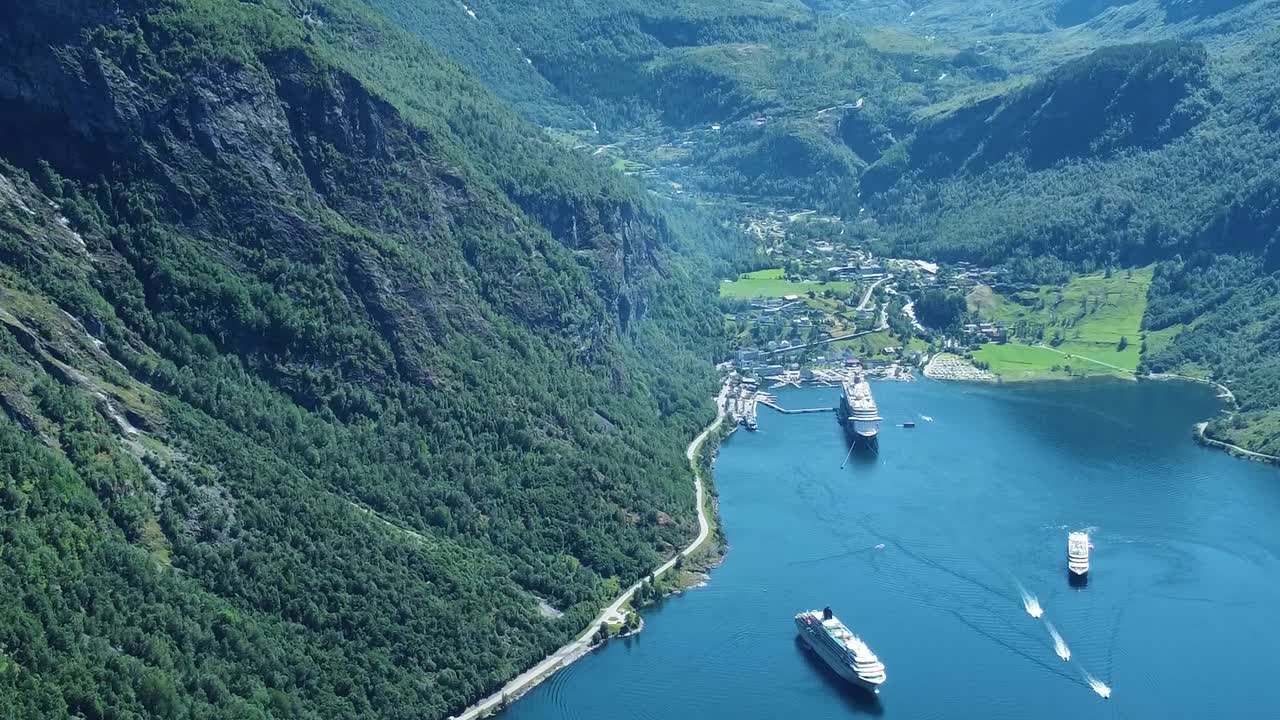 Fjord township with massive cruise ships in Norway, aerial view
