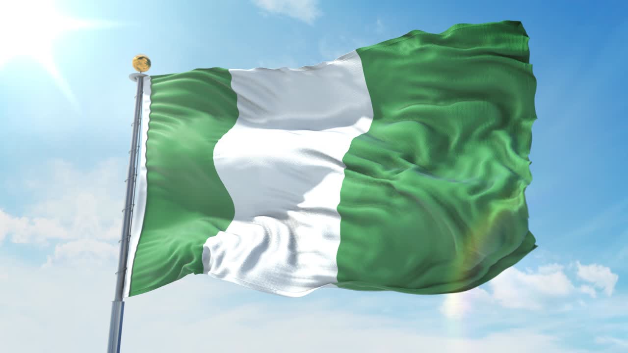 Nigeria flag waving in the wind against deep blue sky. National theme, international concept. 3D Render Seamless Loop 4K