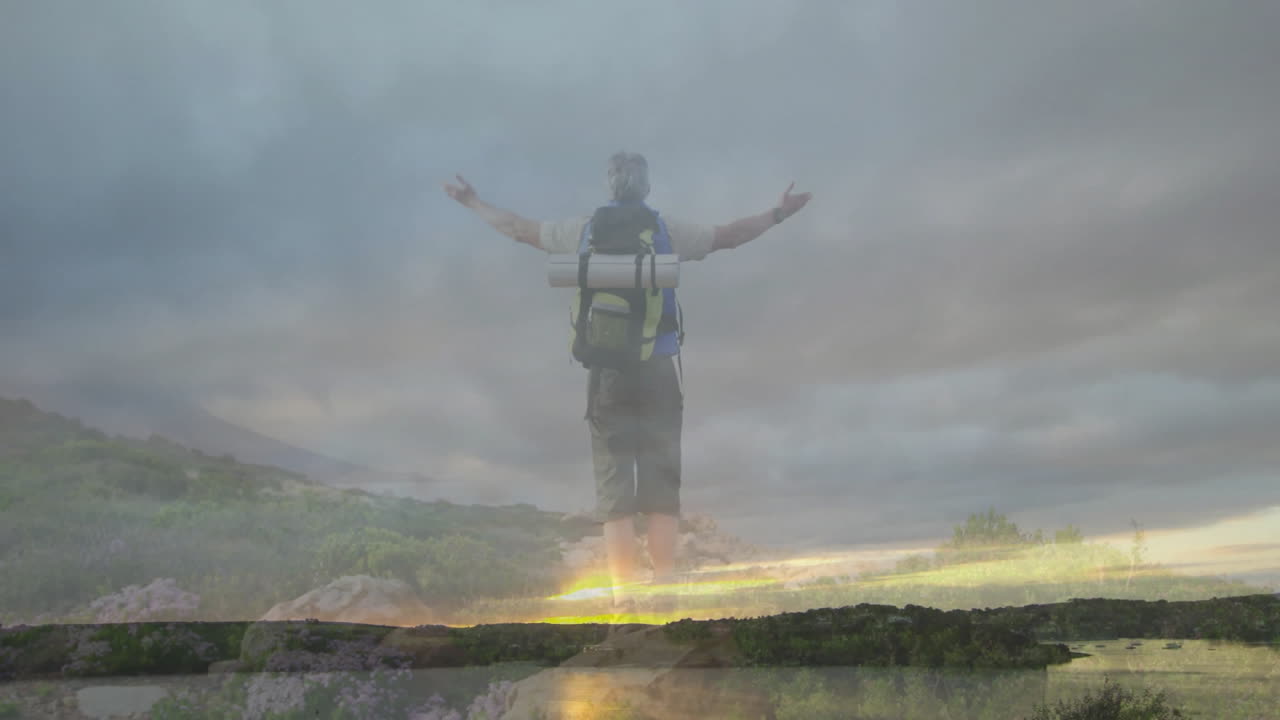 Hiker standing on hilltop at sunrise with backpack and animated heart rate graph tracking health