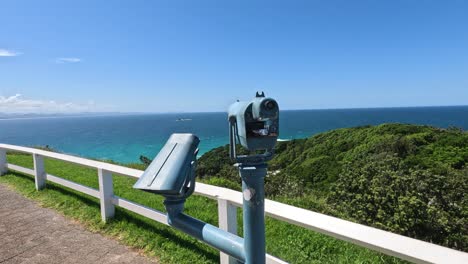 stationary binoculars overlooking a scenic coastline