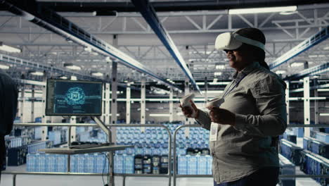 close up of green screen tablet in front of data center engineers improving rigs