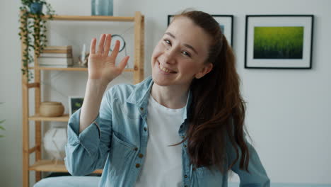 woman smiling and waving