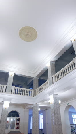 university entrance hall. beautiful interior of a modern building. modern new hall with bright lighting and tv. vertical video