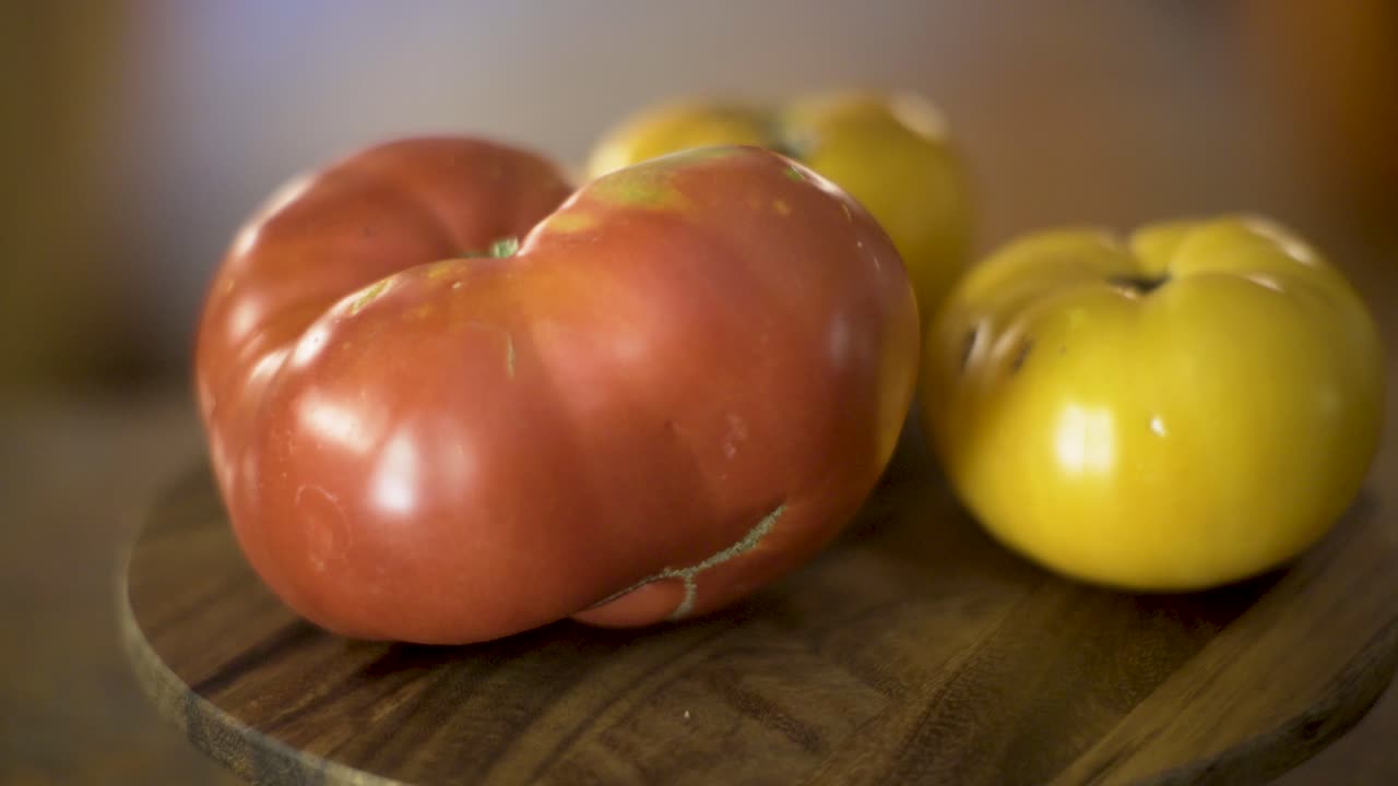 Fresh Tomatoes on a Wooden Board