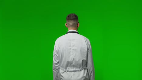 back view of serious thoughtful doctor nodding his head in approval manner thinking and looking around