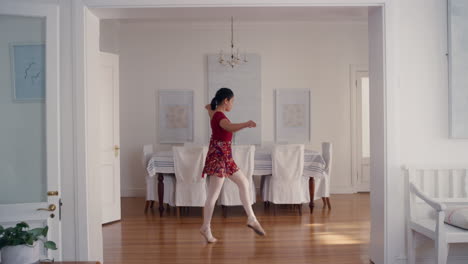 happy teenage ballerina girl dancing practicing ballet dance moves rehearsing at home 4k