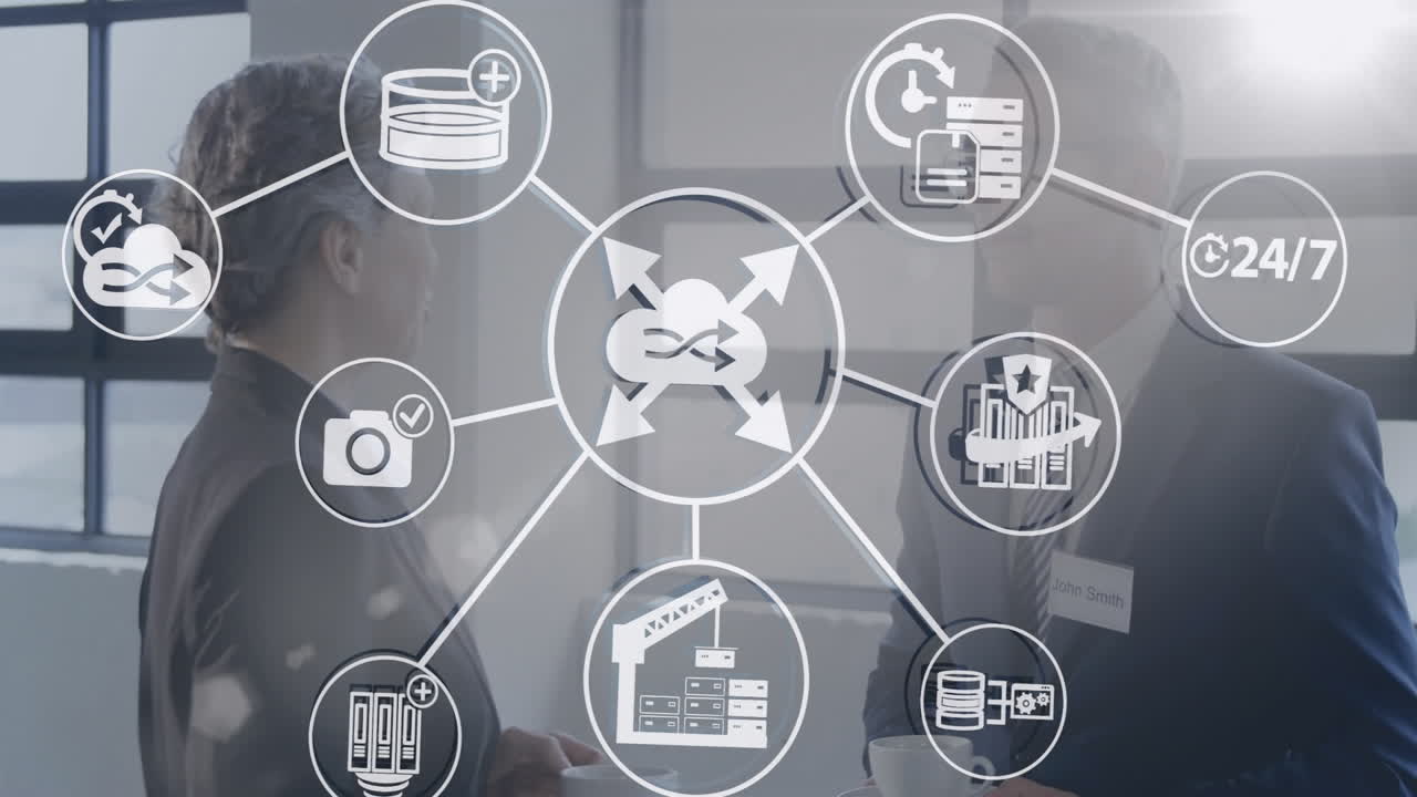 Discussing digital network, business professionals with data icons overlay in office