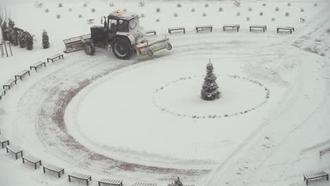 tractor vehicle cleaning the yard from the snow storm