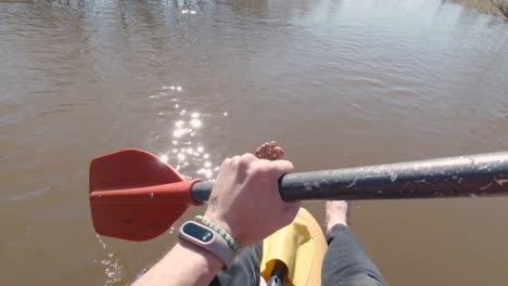 person kayaking on a river