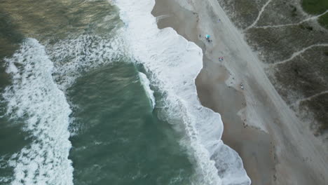 aerial tilt reveal wrightsville beach shoreline, north carolina