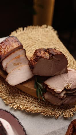 sliced smoked pork on wooden board