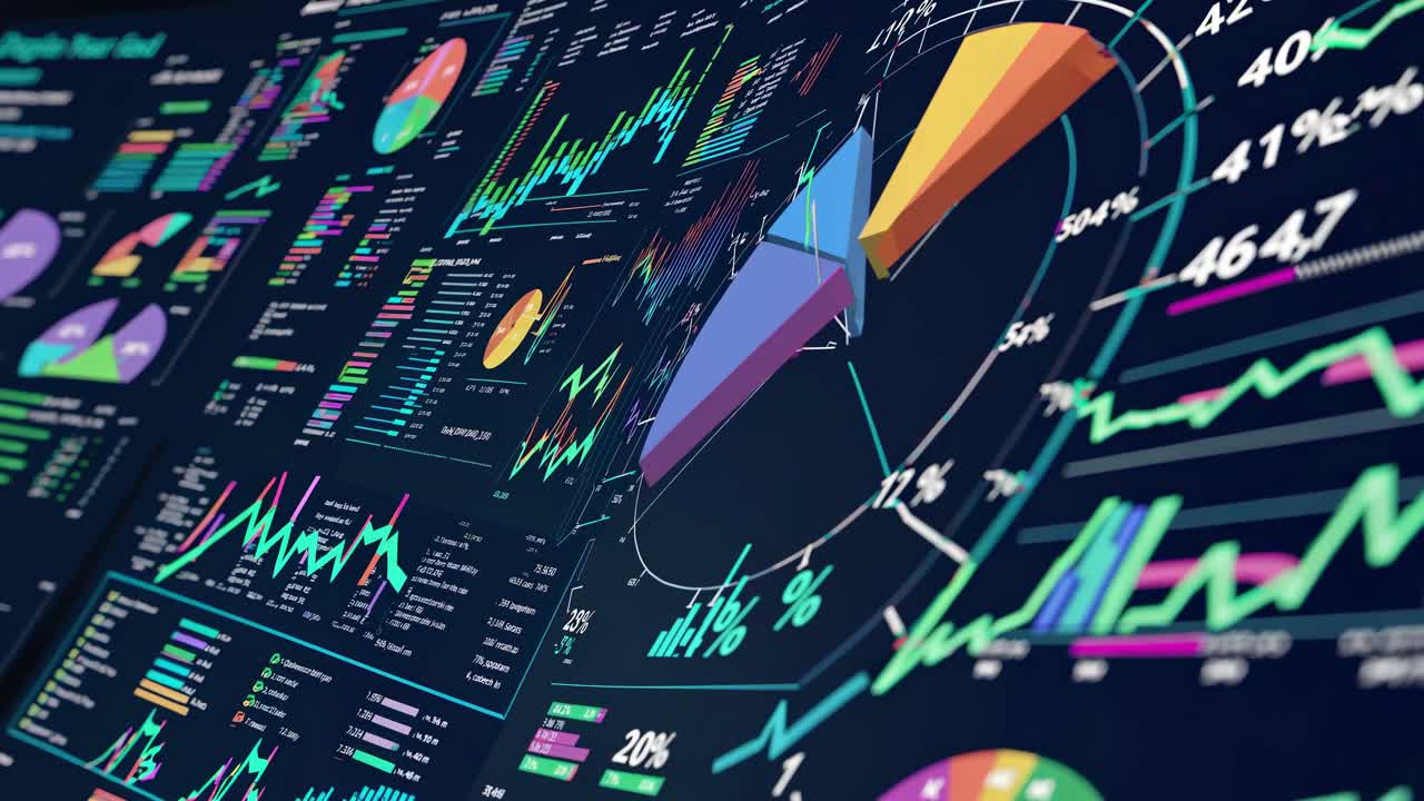 Dynamic video of colorful data visualizations on a digital screen, captured from a tilted angle