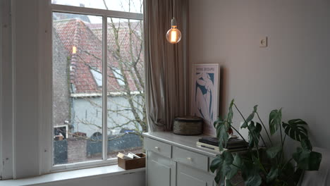 snowfall outside the window of typical dwellings in gouda city center in the netherlands