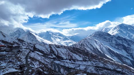Snowy Mountain Range with Village