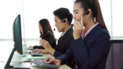 business people wearing headset working in office