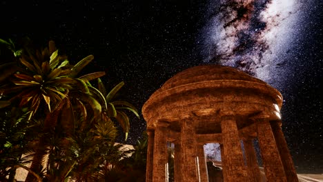 4k antigua ciudad romana en el desierto y estrellas de la vía láctea.
