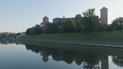 aerial drone shot of krakow poland wawel castle old town with the river vistula at sunrise