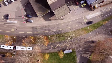 aerial panning top down drone view of a truck going in a road, street travel concept, sankt gallen, switzerland