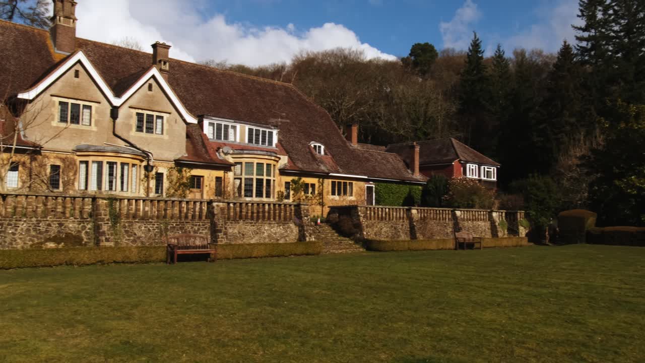 Wide shot of the stunning Fintry Mansion in Surrey Hills during a sunny green day