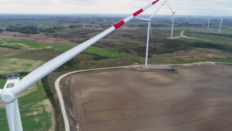 windmills not spinning in the wind farm in kwidzyn, poland - aerial drone shot