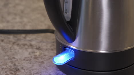 kettle being turned on, boiling water and automatically shutting off