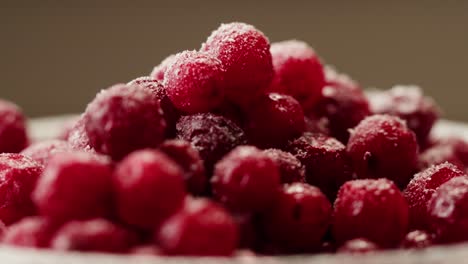 frozen cranberries in snow for tea, background close up of cranberry berries in winter park, ice fridge macro.