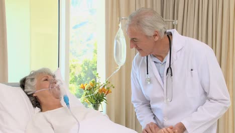 doctor visiting his patient with a oxygen mask