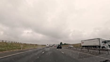 cars traveling on a cloudy oxford road