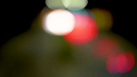 Blurred-cars-lights-driving-by-on-a-highway-slowly-come-into-focus-before-revealing-a-4-lane-highway