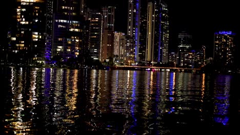 city lights reflecting on water at night