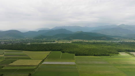 Mountain-Range-and-Crop-Fields-in-Rural-Kakheti,-Georgia,-Aerial