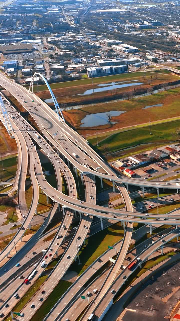 Multiple roads lead to the beautiful bridge in Dallas, Texas, USA. Sunny scenery of the city from top