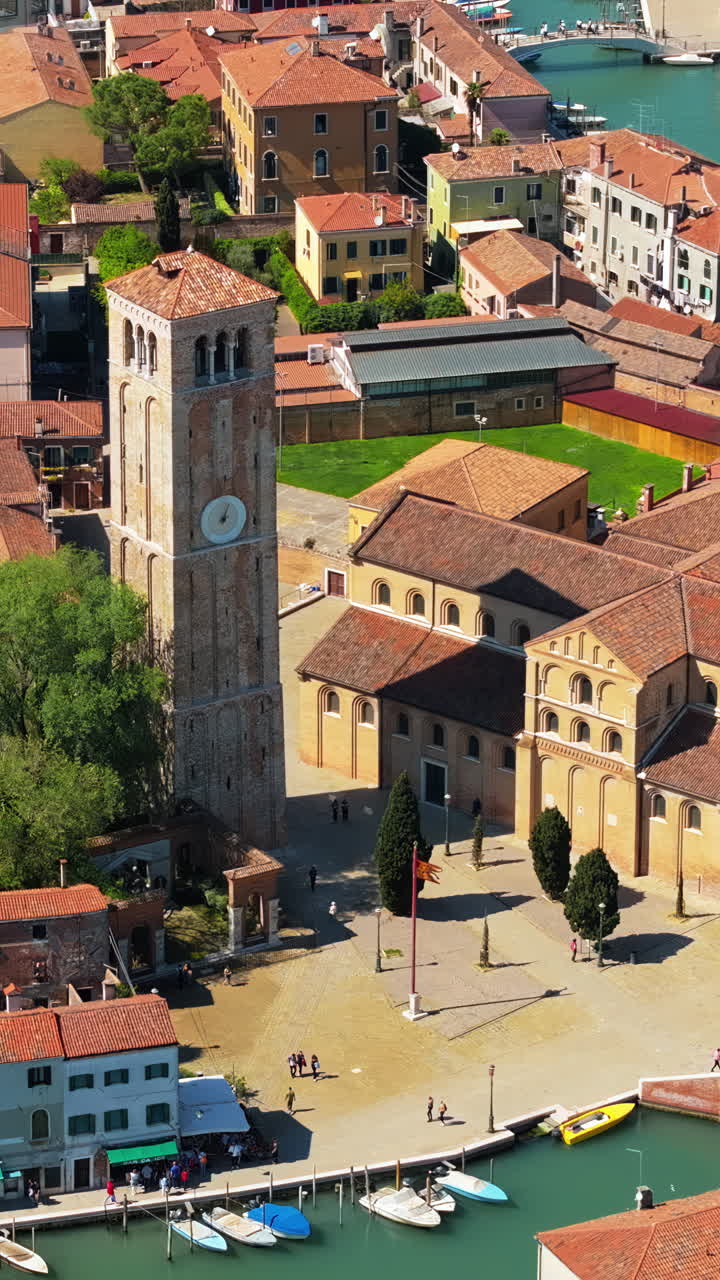Aerial drone view of Basilica dei Santi Maria e Donato in Venice City, Italy in daytime. Verticaal