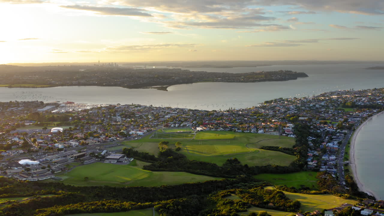 Panoramic Aerial View of a Coastal City at Sunset