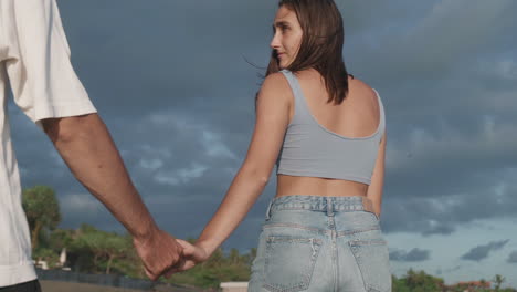 girl looking at boyfriend walking