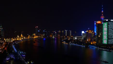noche iluminado paisaje urbano de shanghai centro del río techo panorama 4k china