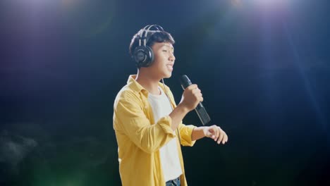 young man singing on stage