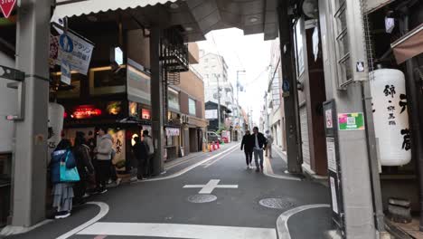 people walking and cycling in osaka street