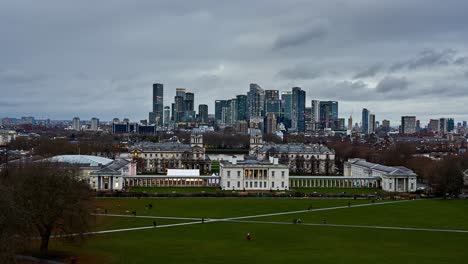 london skyline day to night timelapse overlooking the famous greenwich old royal naval college with the modern skyline of canary wharf in docklands behind