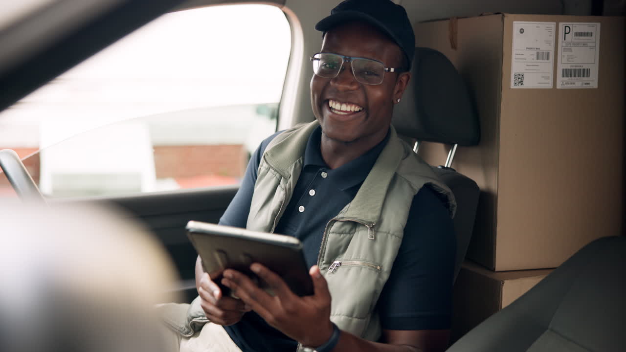 Delivery driver with tablet in vehicle